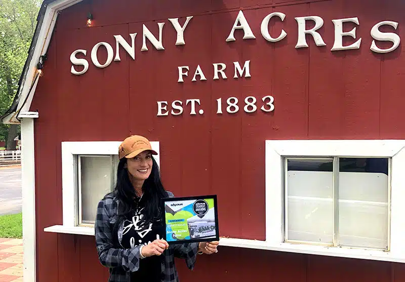 Jeannine Fontana with Adposure Award at Sonny Acres Farm West Chicago IL